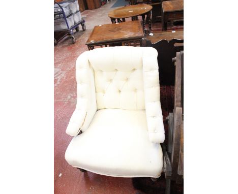 A Victorian low button back chair 