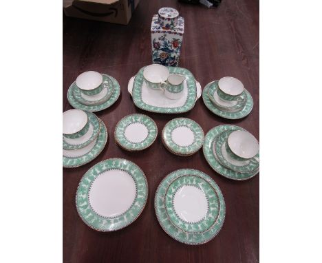 A vintage china part tea set and Booth's tea caddy
