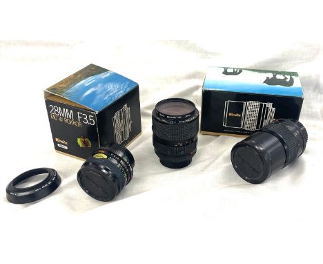 Minolta camera lens / lenses to include 28mm F3.5 MD Rokker, 135mm F2,8 MD tele Rokker, MD Zoom 35-70mm, all untested 