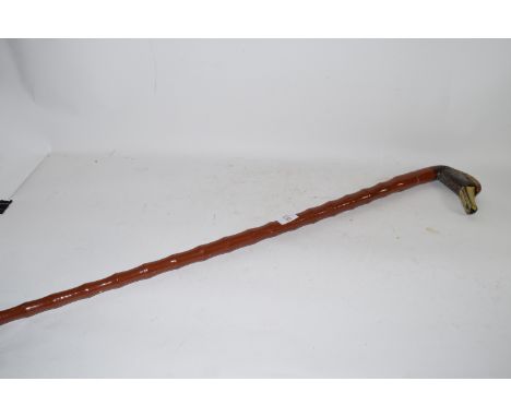 LARGE WALKING STICK WITH HANDLE MODELLED AS A DUCK'S HEAD