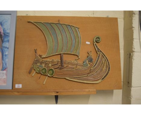 POTTERY MODEL OF A VIKING SHIP MOUNTED ON WOODEN PLAQUE