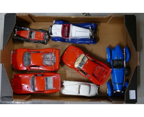 A collection of di-cast burago 1-18th scale cars to include Ferraris, Alpha Romeos, Jaguars, etc. (7) 