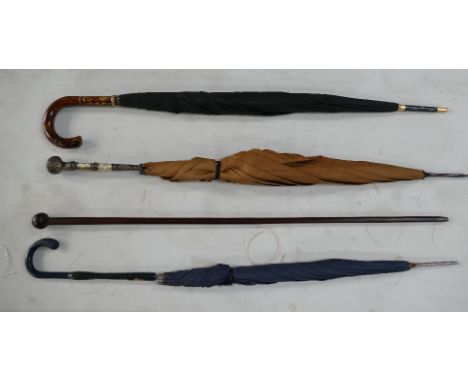 An interesting collection of Umbrella's including Victorian white metal mounted parasol and mahogany swagger stick, etc. (4)