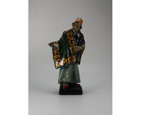 Royal Doulton figure The Carpet Seller HN1464, early version with hand open, impressed date 1933