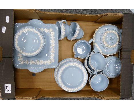 A collection of Wedgwood Queensware items to include teapot, cups, serving platters, saucers, etc. (24 pieces)