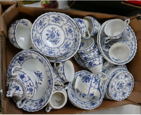 A collection of Johnson Brothers teaware in the Indies pattern to include plates, bowls, cups, saucers, etc.