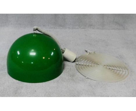 A vintage 1970's rise and fall pendant light shade of domed form in emerald green. H.60cm 