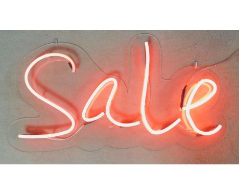 A neon tube wall mounted light up sign. (light doesnt stay on). H.60 W.110cm 
