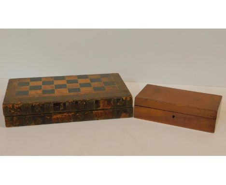 A 19th century cased backgammon and draughts set with faux book spine decoration and a 19th century cased set of games pieces