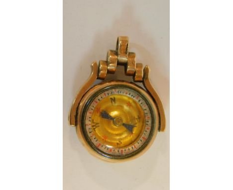An antique nine carat gold compass swivel fob charm, hallmarked: WM&amp;S for Matthew Wilcox &amp; Son, Birmingham. Agate on 