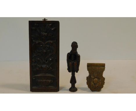 A collection of antique carved wooden treen items. Including an antique carved fruitwood crouching man nut cracker, an antiqu