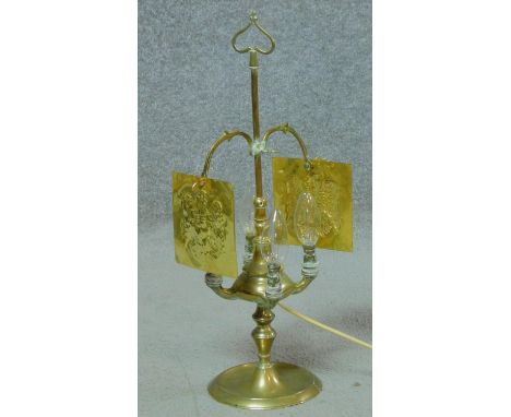 A 19th Century Italian brass lucerna, converted to electric, adjustable, four branch oil lamp. It has two embossed brass plat