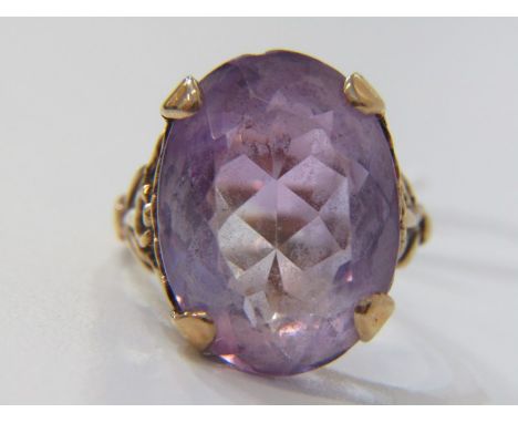 VINTAGE 9CT GOLD AMETHYST SOLITAIRE RING, large oval cut amethyst type stone, in 9ct yellow gold setting, size Q 