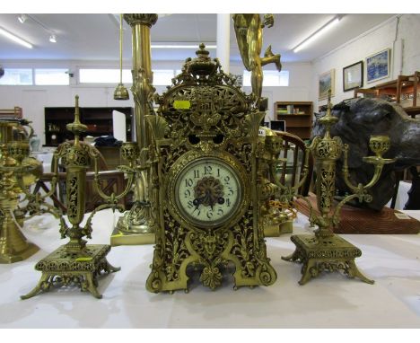 ANTIQUE ORNATE BRASS FRENCH BRACKET CLOCK, with coiled bar strike and a pair of similar twin branch candelabra, 40cm height 