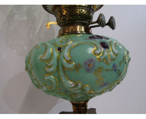DECORATIVE OIL LAMP, green onyx column base with painted milk glass reservoir and green glass crinoline frosted shade, 73cm h
