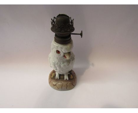 A Victorian porcelain parrot oil lamp, 22cm tall