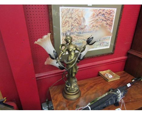 A figural lamp with four fluted shades, 60cm tall