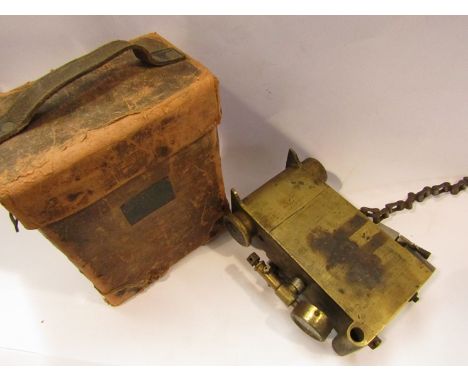 A vintage brass automobile car tyre gauge in leather case