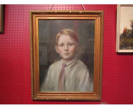 A pastel portrait of young boy, indistinctly signed lower left, gilt framed and glazed, 46cm x 34cm