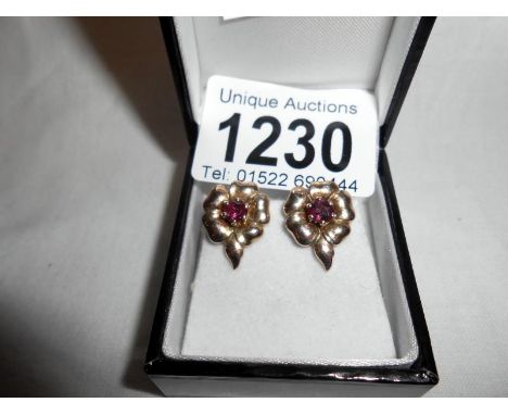 Ruby earrings set in rose gold
