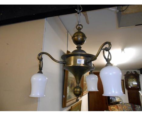 A brass 3 arm ceiling light
