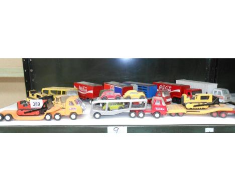 A shelf of small scale Tonka articulated lorries