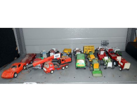 A box of small scale Tonka toys including tractors & Corvette etc.