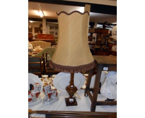 A polished stoneware table lamp