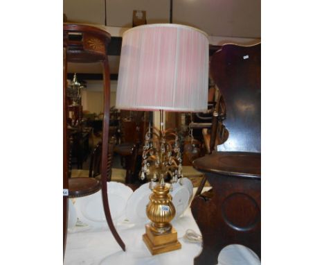 An unusual gilt table lamp with lustre droppers
