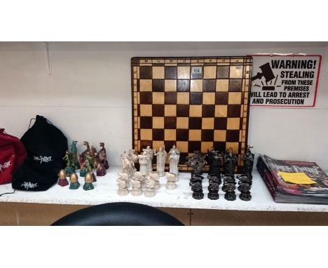 Mixed lot consisting chess board with 3 Harry Potter part chess sets, bags and manuals no. 2-45, 47-53 & 56