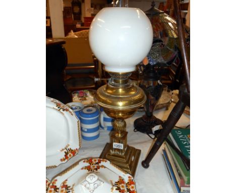 Oil table lamp with brass base chimney and globe