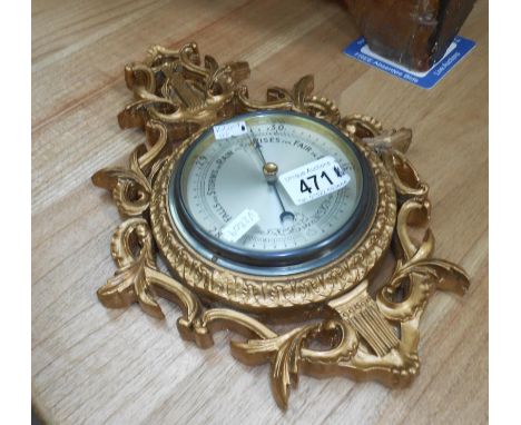 A gilt framed barometer