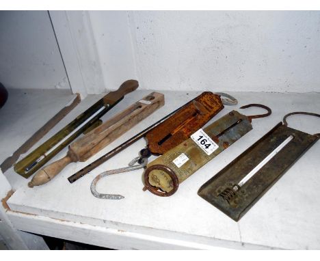 4 milk thermometers and 2 hanging scales