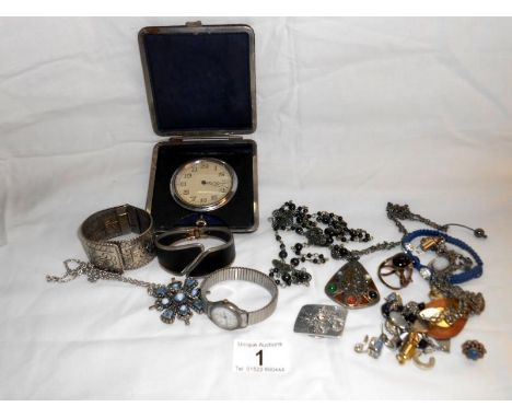 Quantity of costume jewellery and a travelling clock