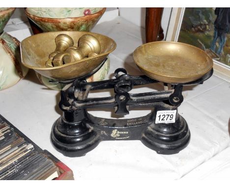 Set of kitchen scales with brass pans and set of brass bell weights