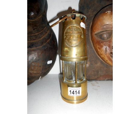 A brass Miner's lamp The Protector Lamp Lighting C L Eccles Manchester