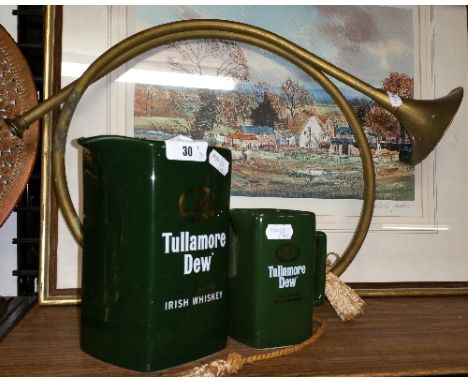 A Wade Tullamore Dew Whiskey Water Jug, another Tullamore Dew jug smaller (unmarked) & a brass hunting horn (3).