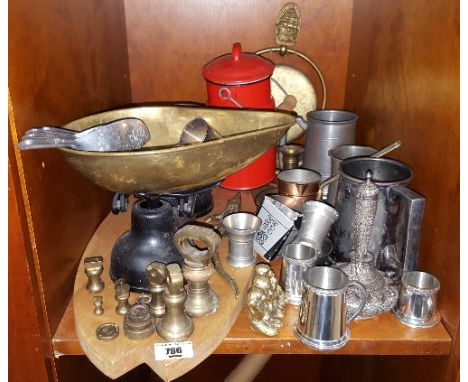 A 19th Century Brass Scales, Weights, Measures, Tankards etc. on one shelf.