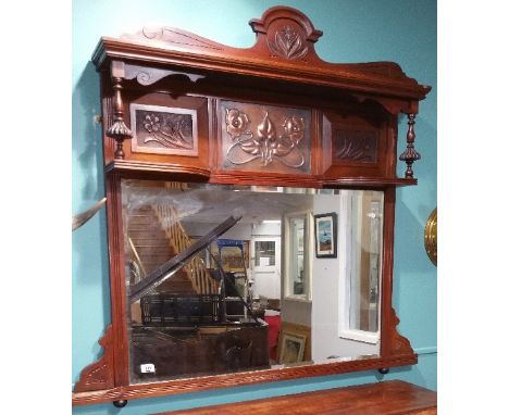 An Art Nouveau Walnut Overmantel Mirror with inset copper panel, bevelled glass. 41ins (h) x 45.5ins (w).