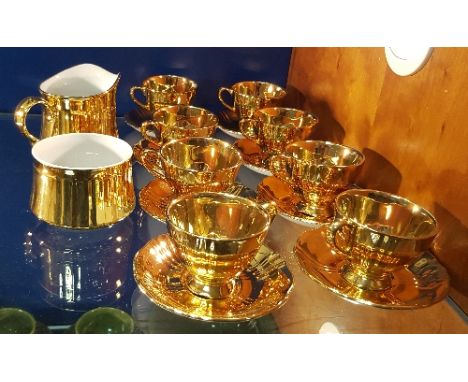 A Royal Winton Grimwades Part Tea Set for Eight along with a Royal Worcester Figure.