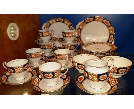 A Roslyn China Tea Set with eight cups, saucers & side plates, sugar bowls, milk jug & two cake plates (with four extra side 