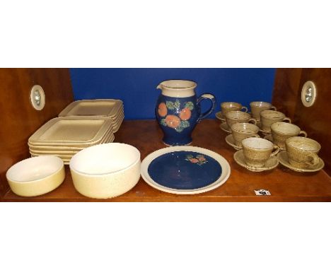 A Full Shelf of Various Pottery Items.