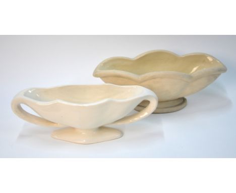Two white monochrome vases; one with Constance Spry/Made in England marks; the other with an impressed mark; the first about 