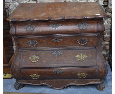 An 18th century Dutch floral mahogany bombe commode, the moulded edge shaped top over four long graduated drawers with ornate