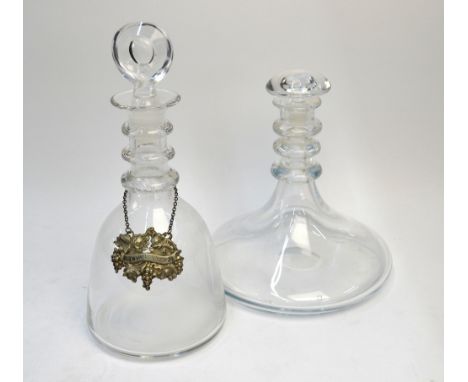 Two plain decanters, each with three neck rings, one bell shaped with target stopper and a silver plated 'Hollands' bottle ti