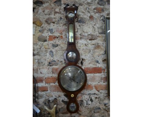 An inlaid mahogany reproduction stick barometer by Thomas Wright of Sarum, with mercury column and alcohol thermometer on sil