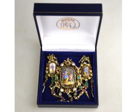 A 19th century gilt metal baroque pendant/brooch set with a Neo-classical ceramic plaque surrounded by pearls and foil-backed