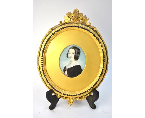 A Victorian oval portrait miniature on ivory of a lady, inscribed on reverse 'Painted in Glasgow by Edward Robertson, 1846', 