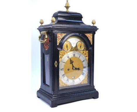 A George III ebonised bracket clock by Francis Atkins, London, with moulded caddy-top, brass pineapple finials and side loop 