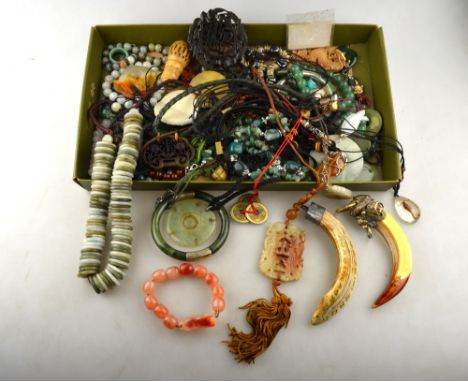 A large collection of jade and green stone jewellery items including necklaces, bangles, pendants etc to/w various Asian jewe